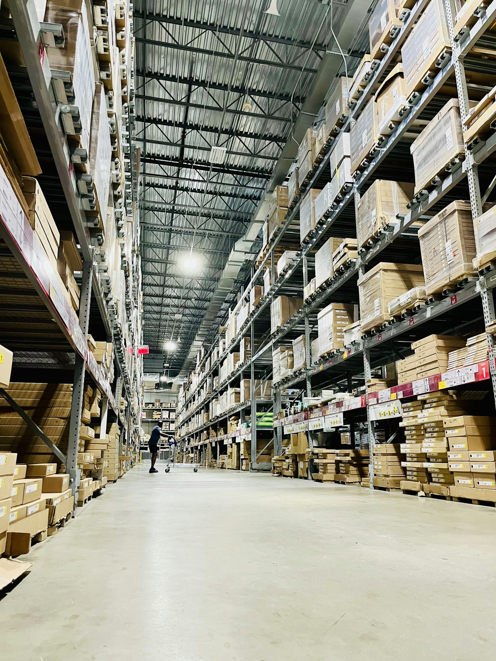 Tall pallet racking in a distribution warehouse aisle